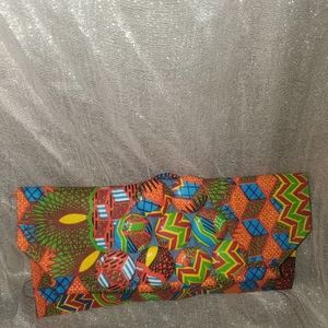 vibrant african print handmade cloth clutch w/ oversized button accents...